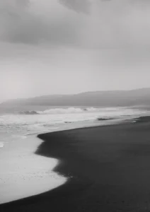 Black sand and white wave