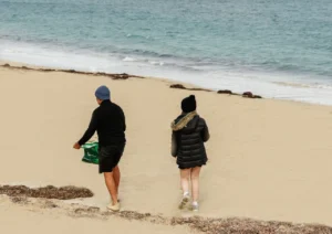 Collecting coal along the beach