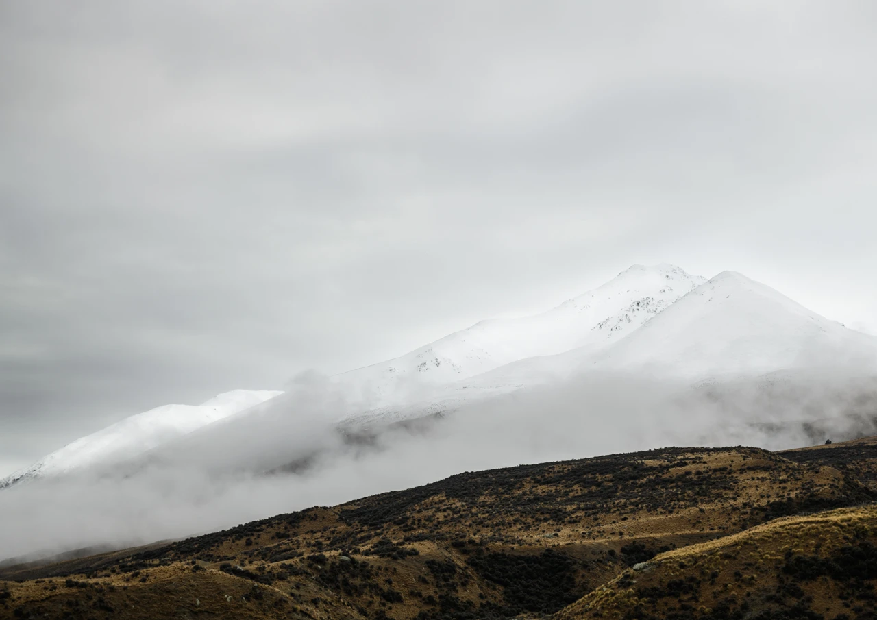 Brown hills and mountains in the fog