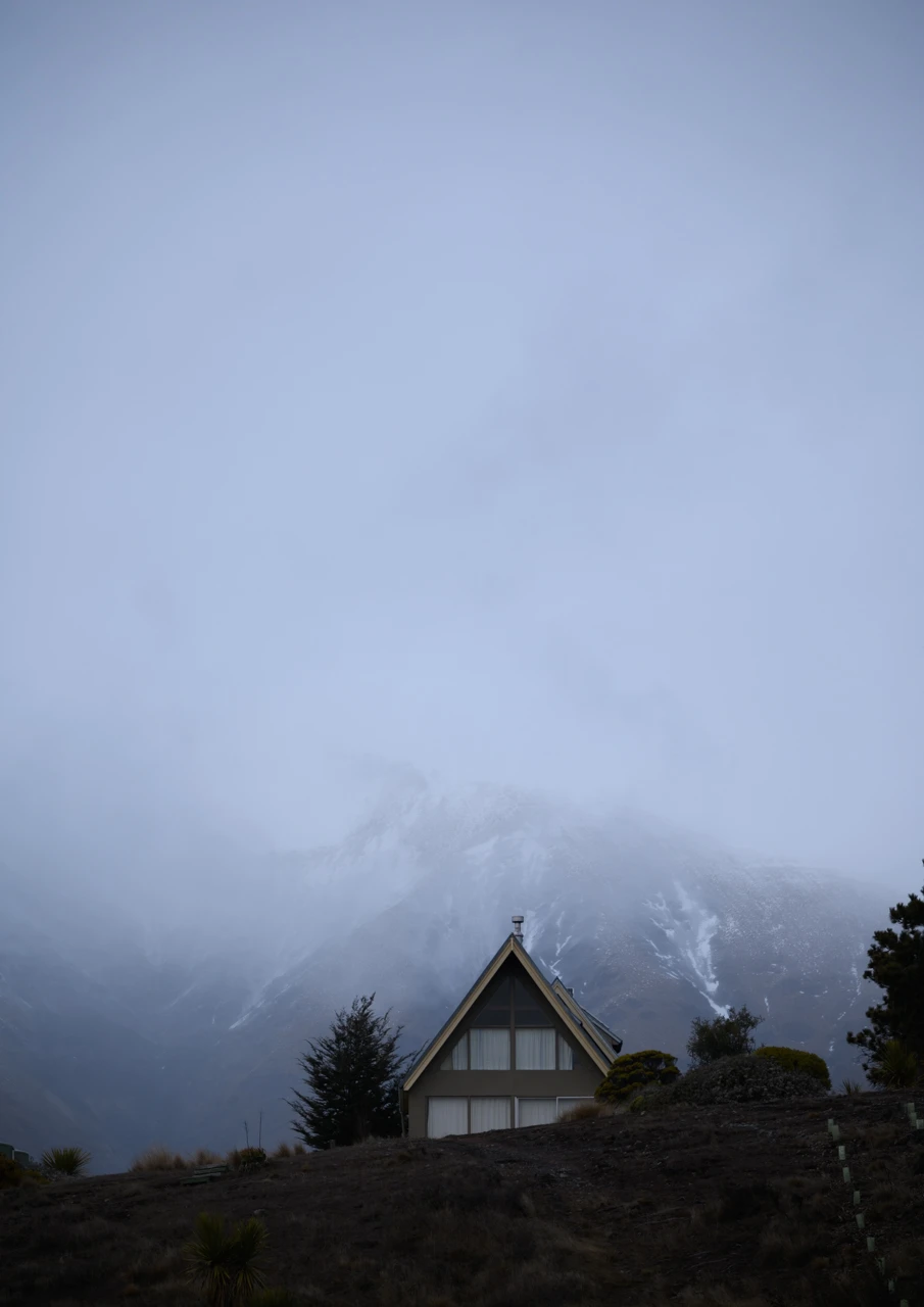 A framed house in the mountains