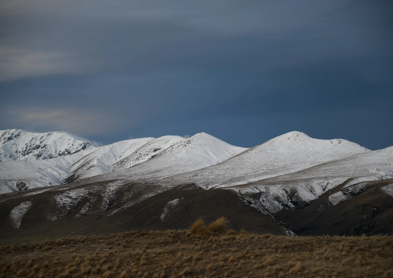 blue sky and snow on the mountains