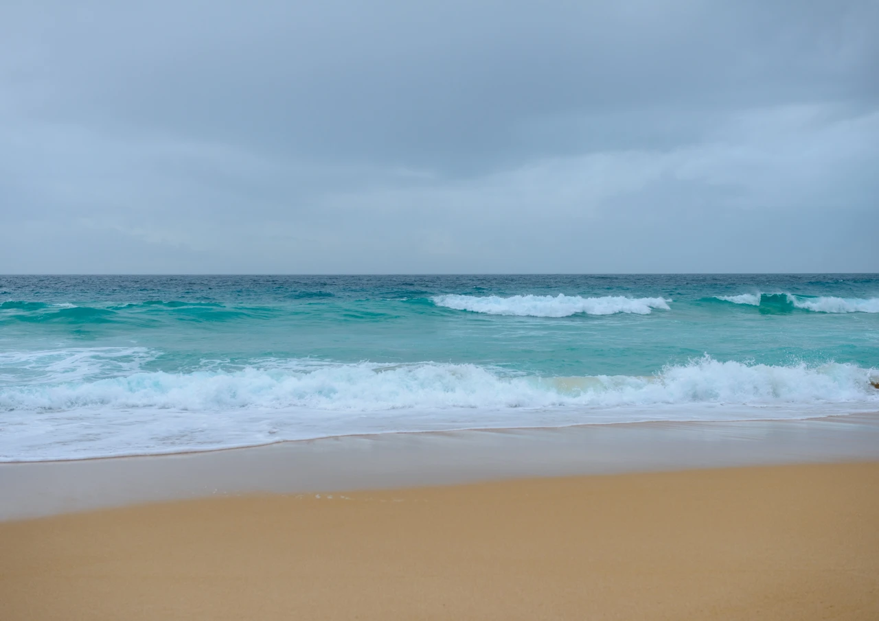 Turquoise beach and waves rolling in