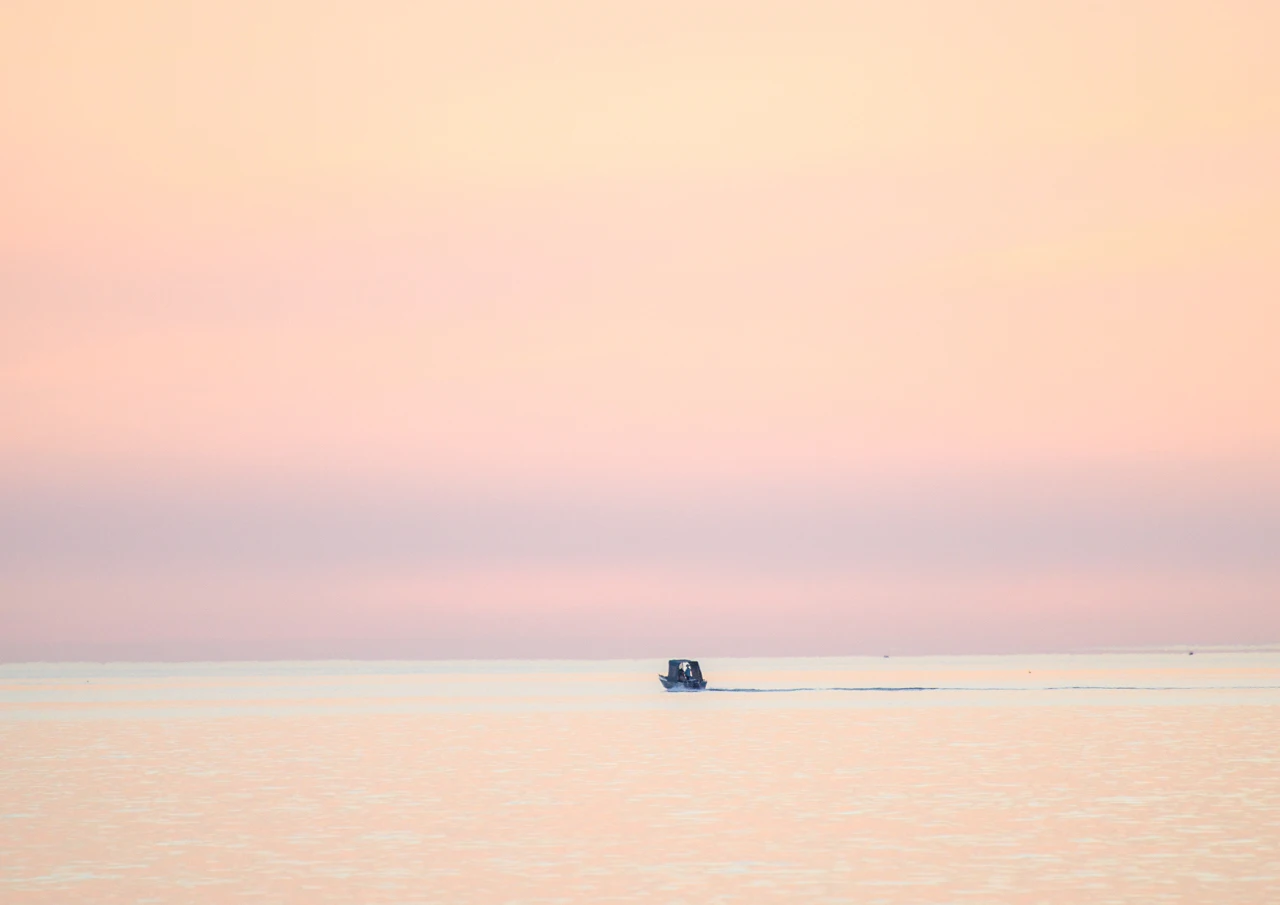 Fishing boat staying out till the end of the day.