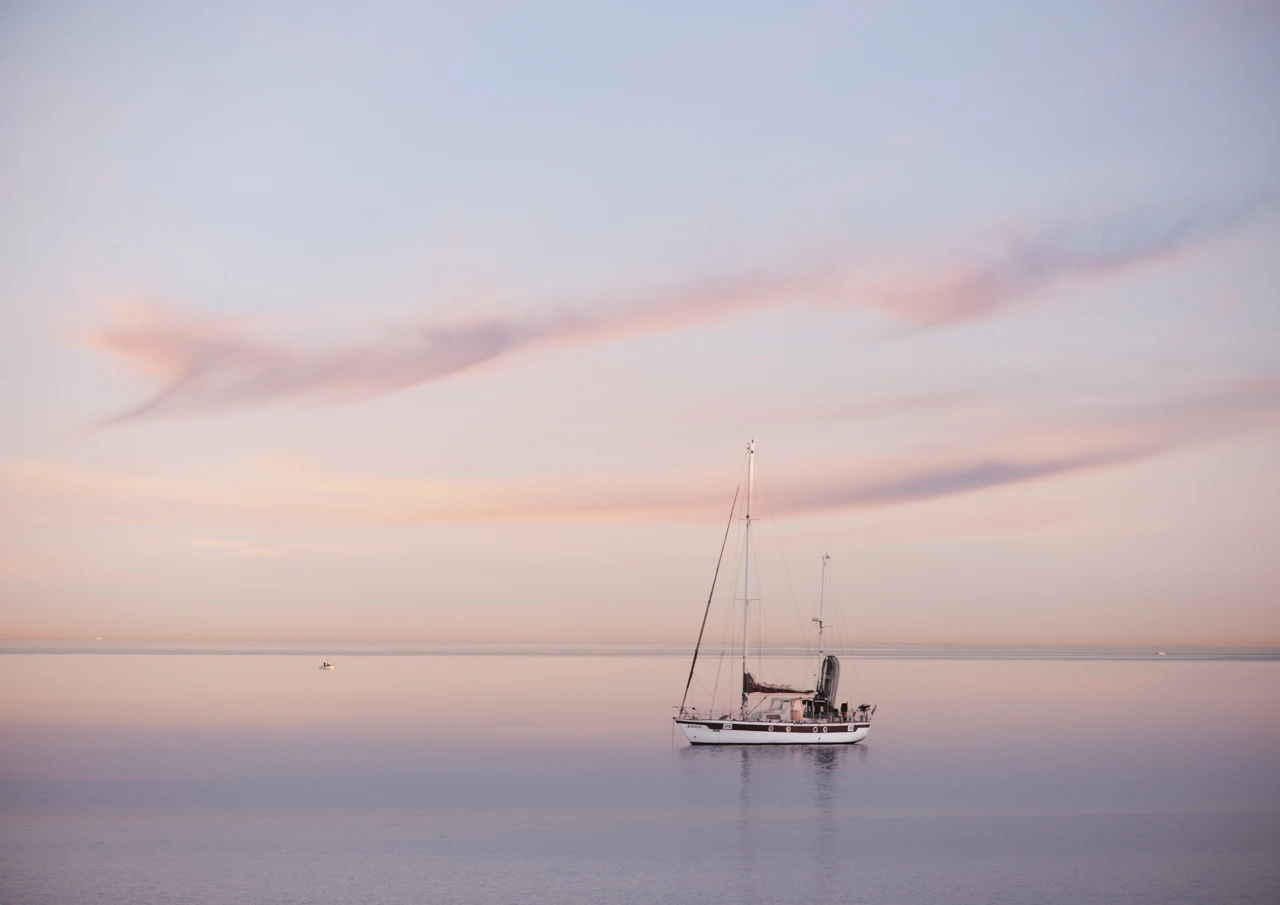 Yacht moored in pink sunset