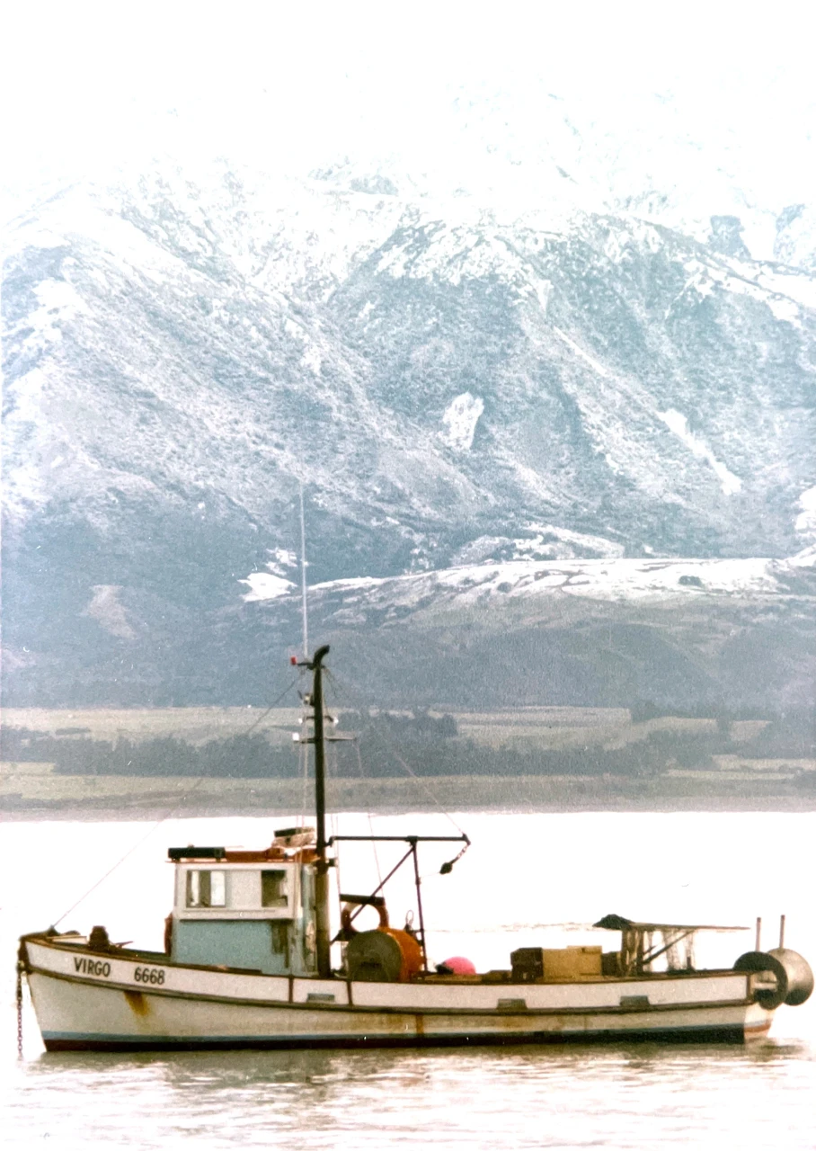 Fishing boat and Kaikoura mountains