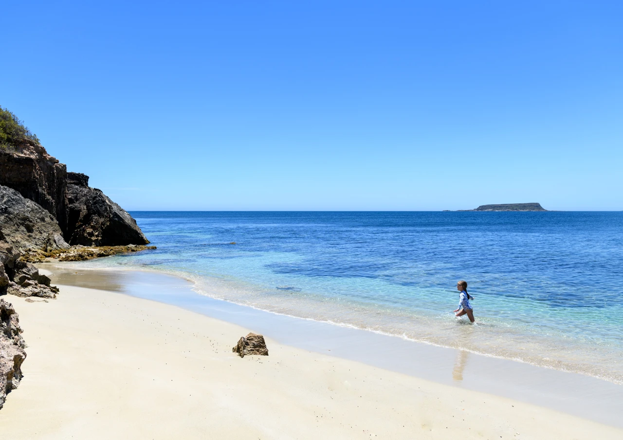 Child playing in the sea water